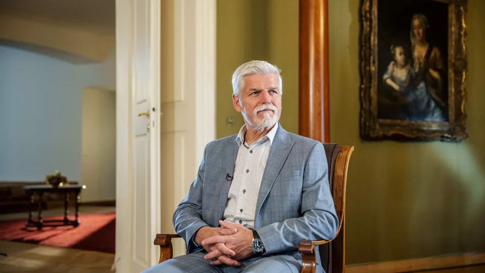 Petr Pavel seated in a wide Bloomberg interview composition